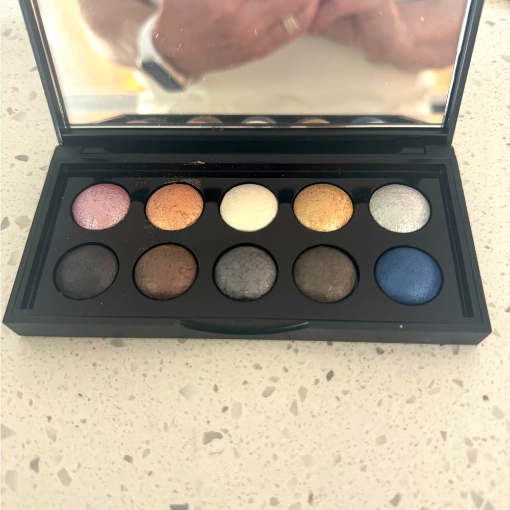 Bundle of eyeshadow, eye liners, lip liner, and eyeshadow brush